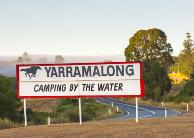 entry sign to yarramalong camping by the water